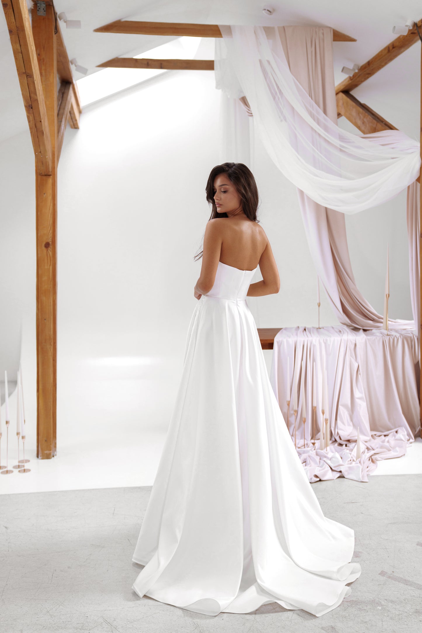 Grace wedding dress by Sonya Soley – back view of strapless satin gown with flowing train