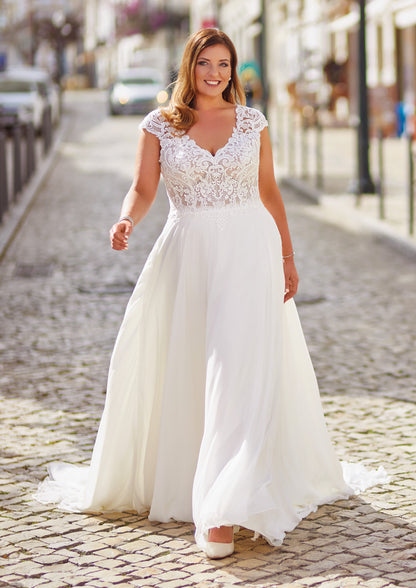 Mirelle by Très Chic plus size ivory chiffon A-line wedding dress with lace V-neck bodice and cap sleeves