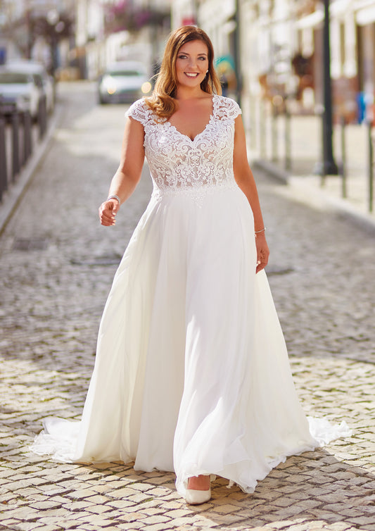 Mirelle by Très Chic plus size ivory chiffon A-line wedding dress with lace V-neck bodice and cap sleeves