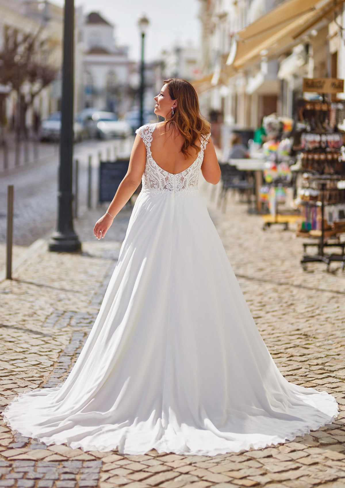 Mirelle plus size chiffon wedding gown with lace V-back, flowing A-line skirt and bridal train