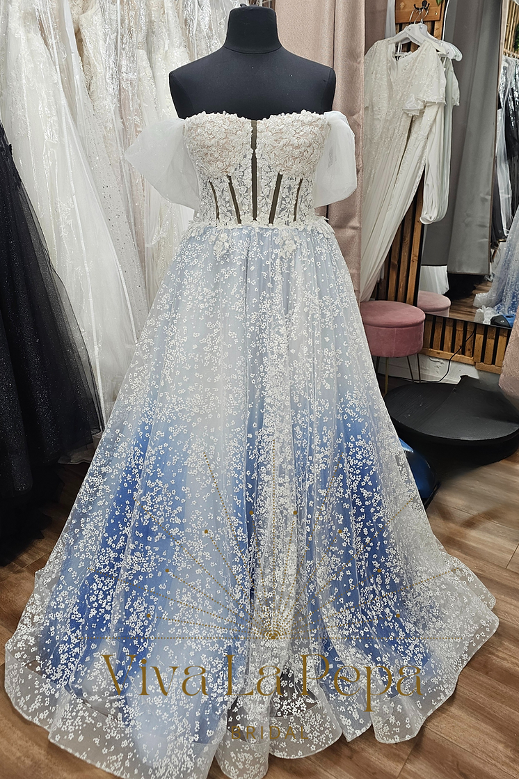 Front view of Estella Luna wedding dress by Viva La Pepa with blue underlayer and floral tulle overlay