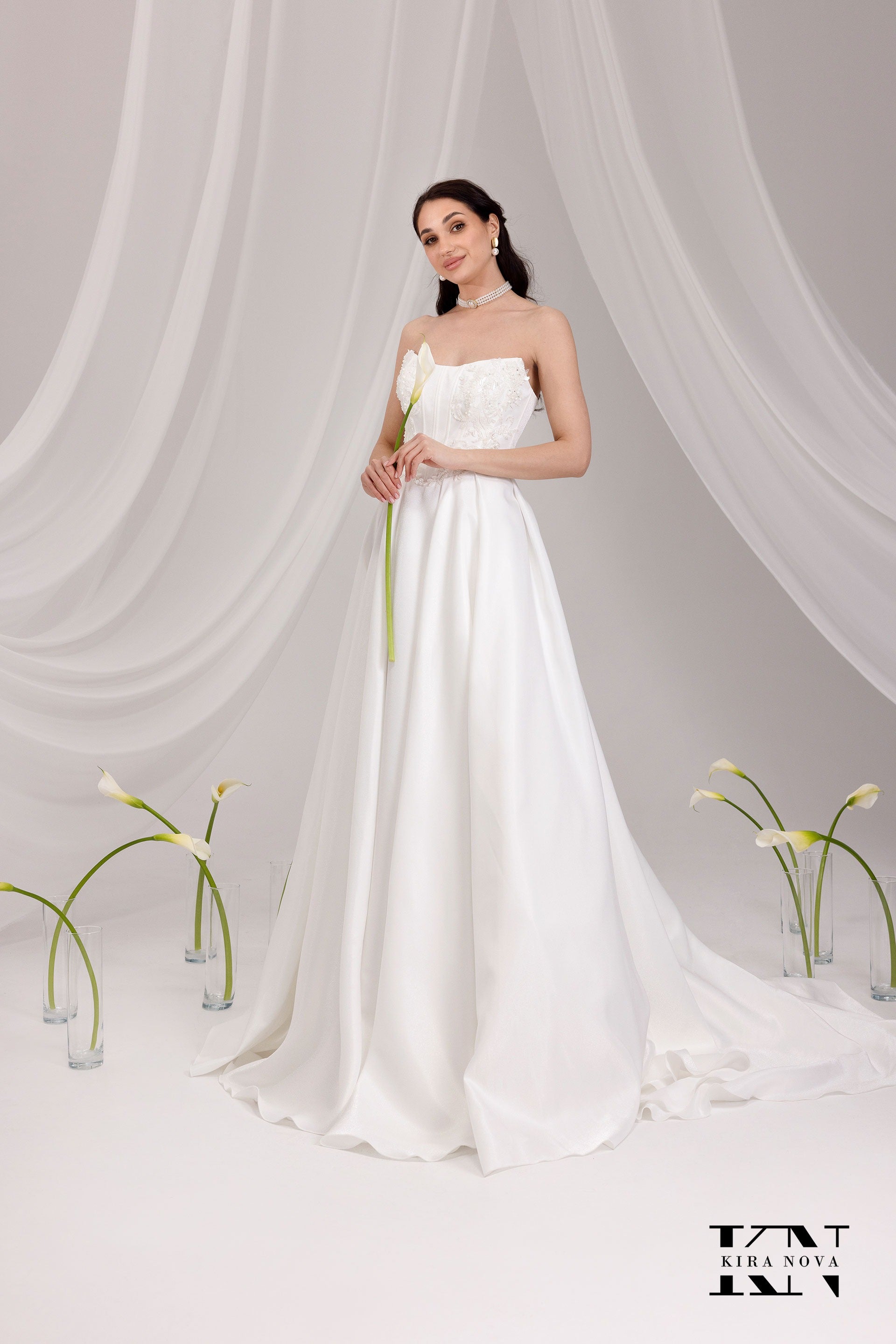Kira Nova Admina strapless wedding gown with embroidered corset bodice and satin A‑line skirt