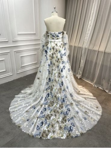 Alyssa blue floral lace wedding dress back—strapless back, flowing chapel train with blue botanical embroidery.