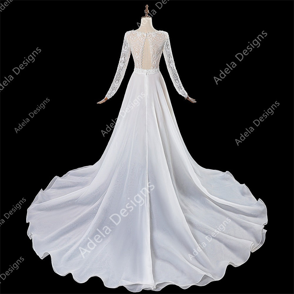 Back view: Marthe lace wedding dress with keyhole back and flowing detachable train.