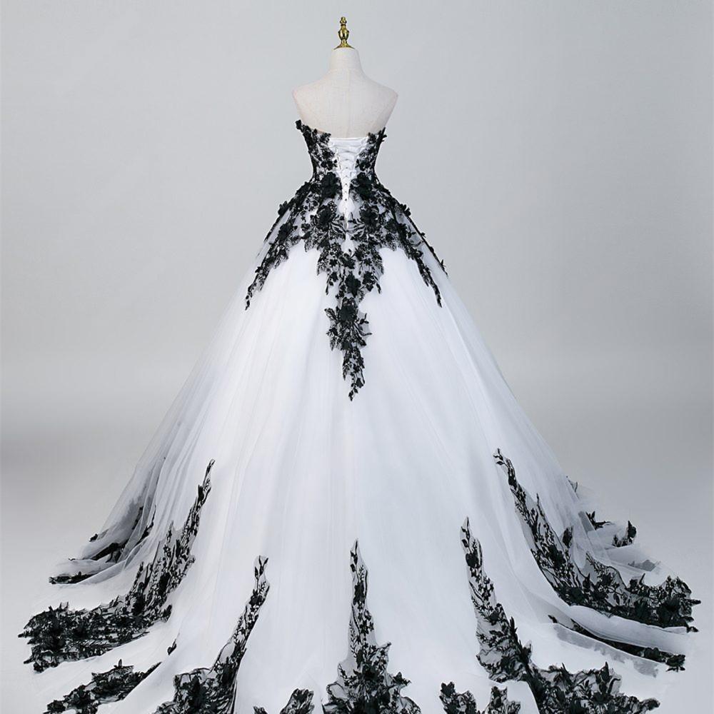 Black lace gothic wedding dress with dramatic train and ball gown shape
