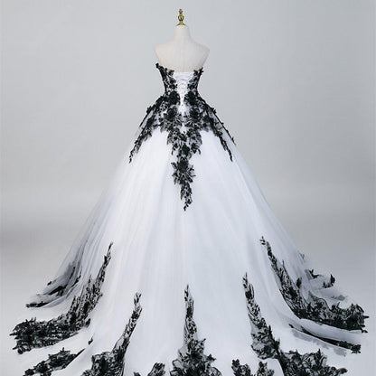 Black lace gothic wedding dress with dramatic train and ball gown shape