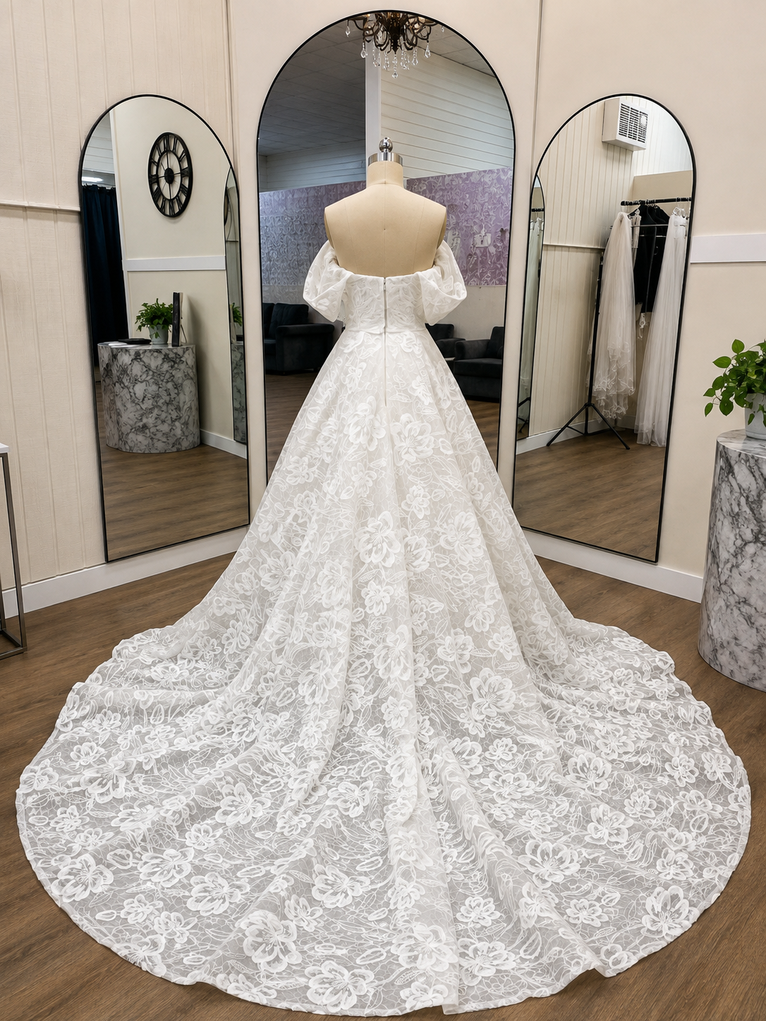 Catalina ivory floral lace wedding gown with off-the-shoulder back and dramatic sweeping lace train