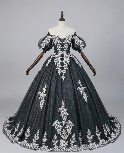 Gothic bridal dress with off-shoulder neckline and dramatic floral border hem