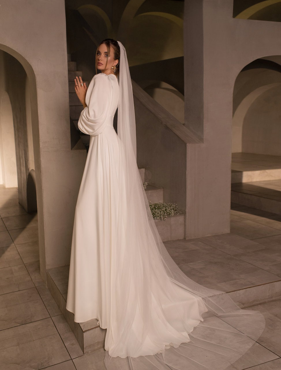 Vintage-Inspired Long-Sleeve Wedding Dress with Puff Sleeves, Deep V-Neckline, and Flowing A-Line Silhouette, Featuring Button Details