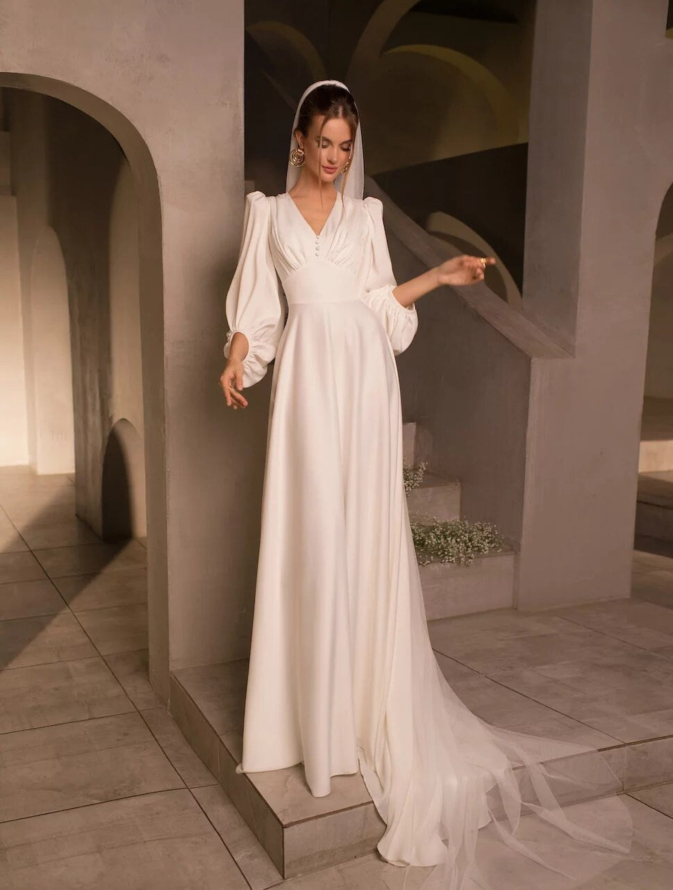 Vintage-Inspired Long-Sleeve Wedding Dress with Puff Sleeves, Deep V-Neckline, and Flowing A-Line Silhouette, Featuring Button Details