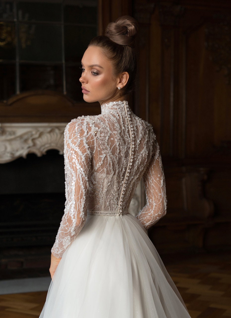 Elegant Long-Sleeve Wedding Dress with High Neck and Beaded Lace Bodice - Classic Tulle A-Line Bridal Gown Timeless Sophisticated Weddings