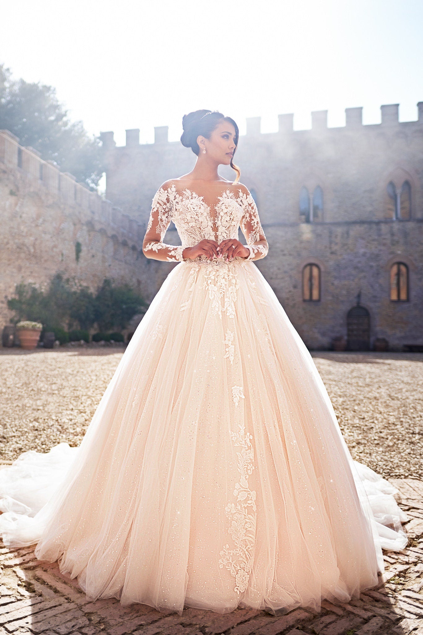 Elegant Long-Sleeve Lace Ball Gown Wedding Dress with Illusion Neckline and Sparkling Tulle Skirt, Featuring Intricate Floral Appliqués