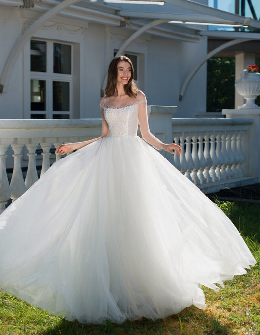 Elegant A-Line Princess Wedding Dress with Sheer Neckline and Beaded Bodice - Luxurious Sparkle Tulle Bridal Gown