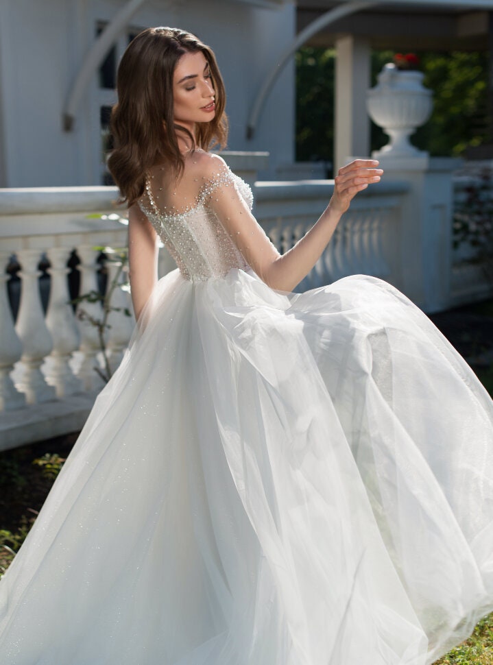 Elegant A-Line Princess Wedding Dress with Sheer Neckline and Beaded Bodice - Luxurious Sparkle Tulle Bridal Gown