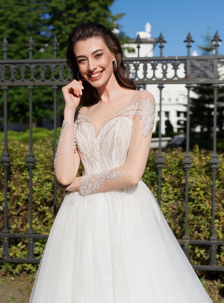 Romantic Off-Shoulder Wedding Dress with Beaded Bodice and Tulle Skirt - Elegant A-Line Bridal Gown for Timeless and Sophisticated Weddings