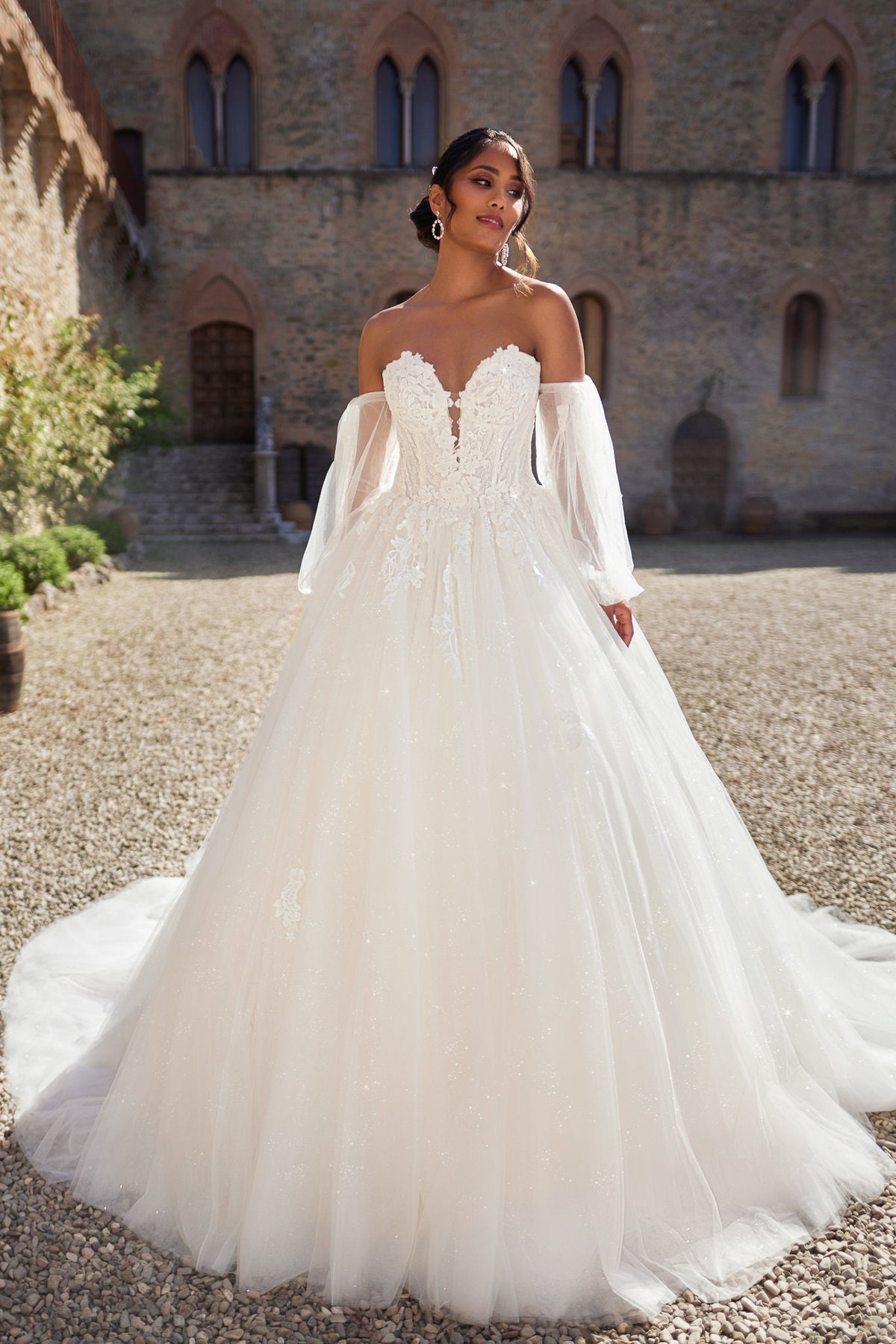 Romantic Off-Shoulder Ball Gown Wedding Dress with Detachable Puffy Sleeves and Intricate Lace Appliqués, Featuring a Sparkling Tulle Skirt