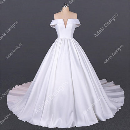 Adela Designs Fanny satin off-shoulder ball gown wedding dress, front view with deep V and full skirt