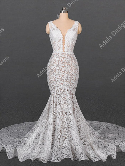 Alma mermaid lace wedding dress with plunging V-neck and chapel-length train, boho bridal gown.