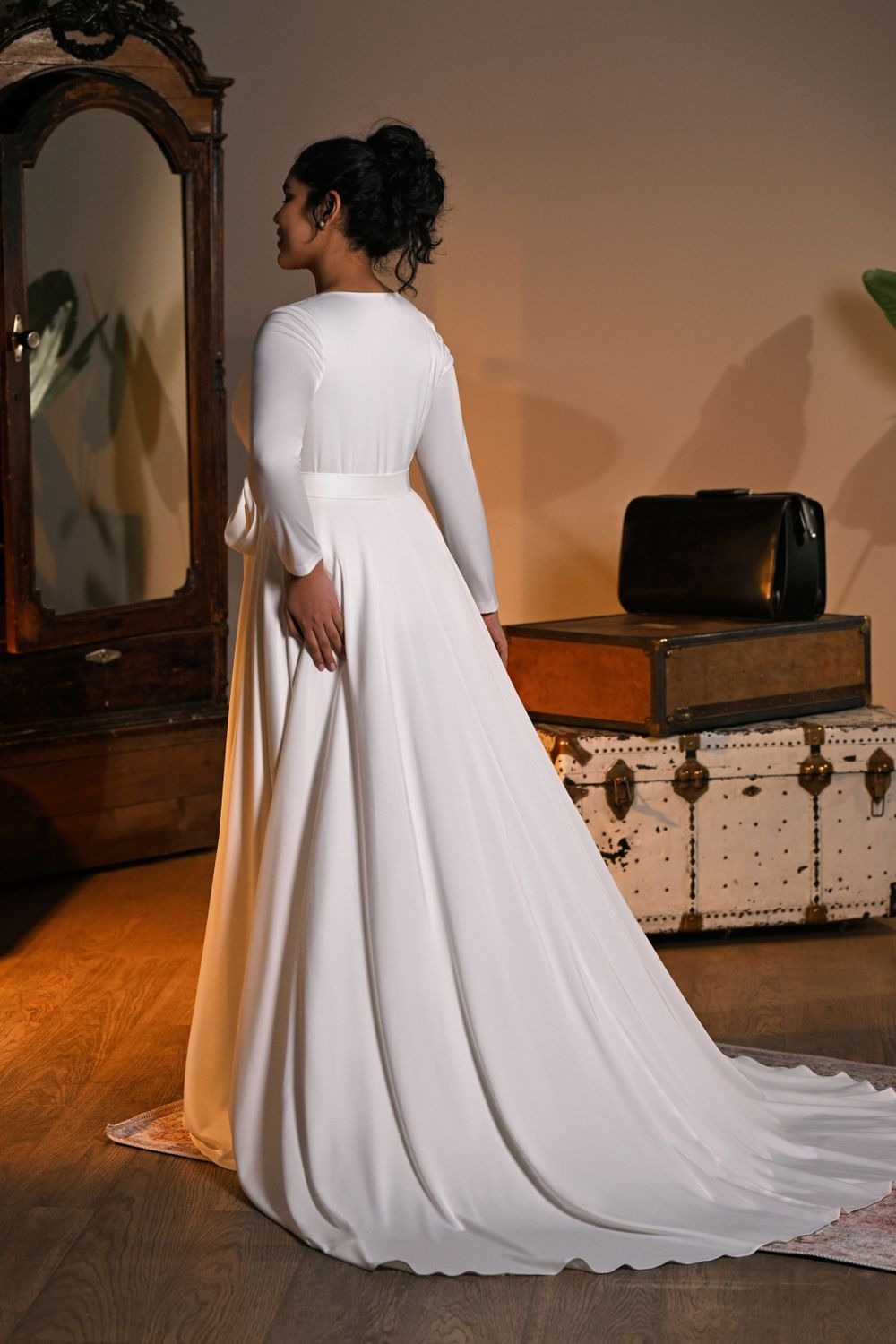 Lakvena wrap wedding gown back view with long sleeves, belt, and sweep train—Kookla by Tatiana Kaplun