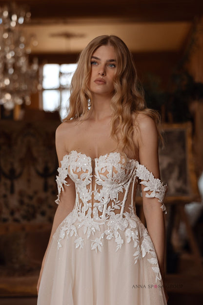 Close-up of Bryaxis wedding dress floral corset bodice with off-the-shoulder lace detailing