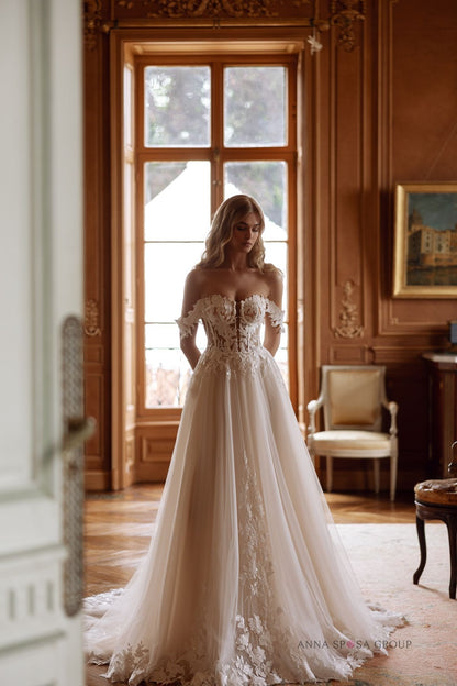 Full-length view of Anna Sposa Bryaxis gown with romantic A-line tulle skirt