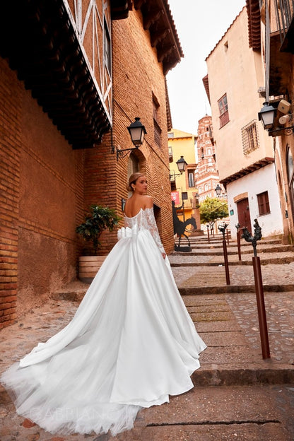 Back view of Parish dress with train and dramatic bow