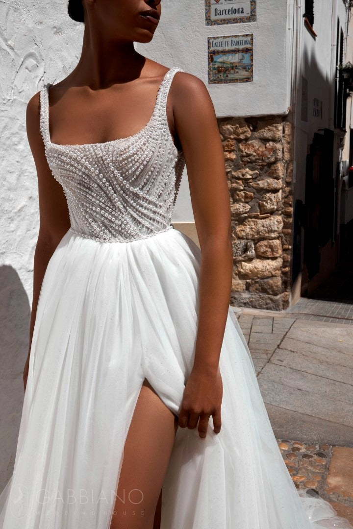 Close‑up of the pearl‑beaded corset bodice and square neckline