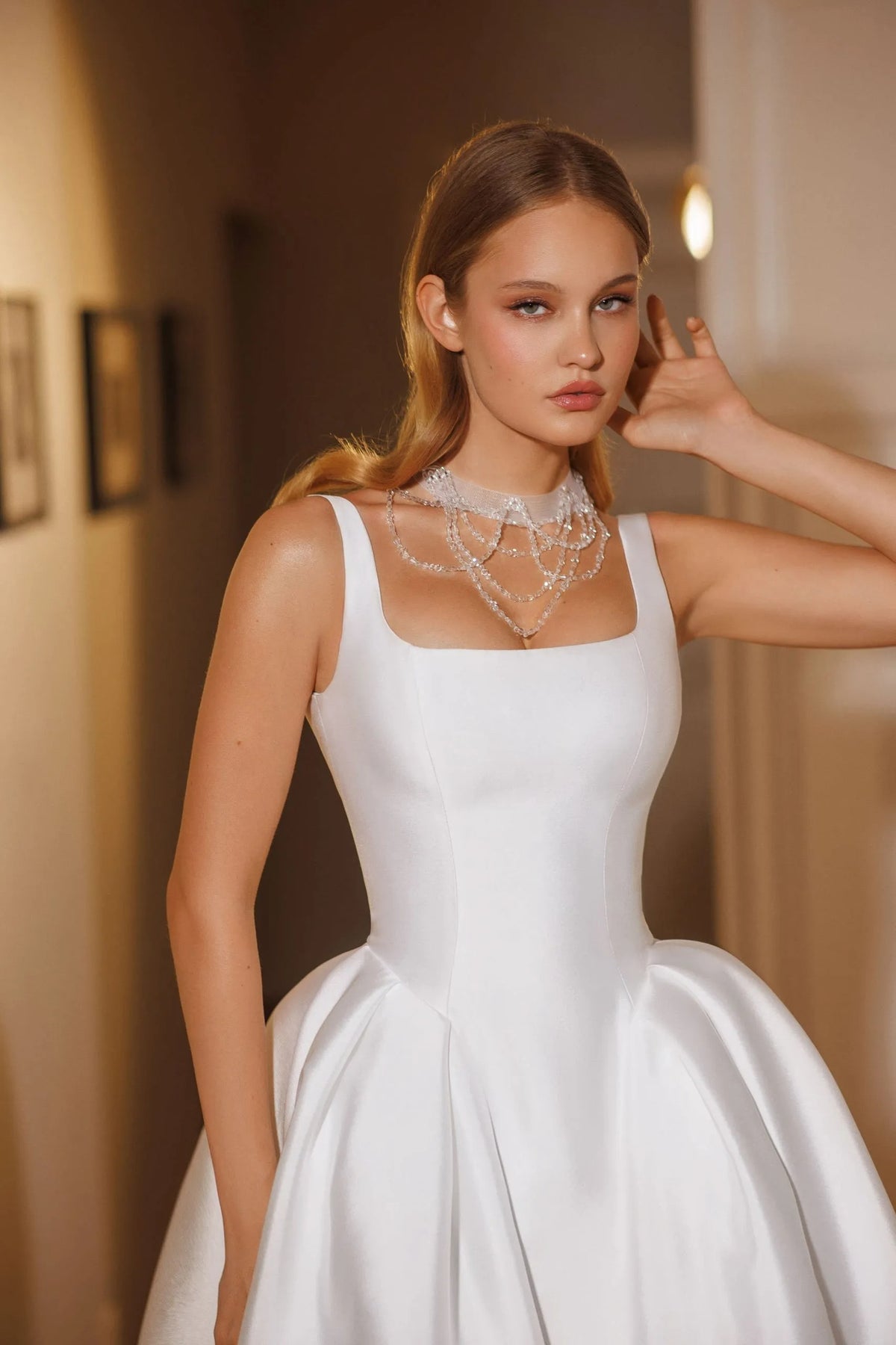 Cappella by Natalia Romanova satin wedding dress with square neckline and sculpted fitted bodice