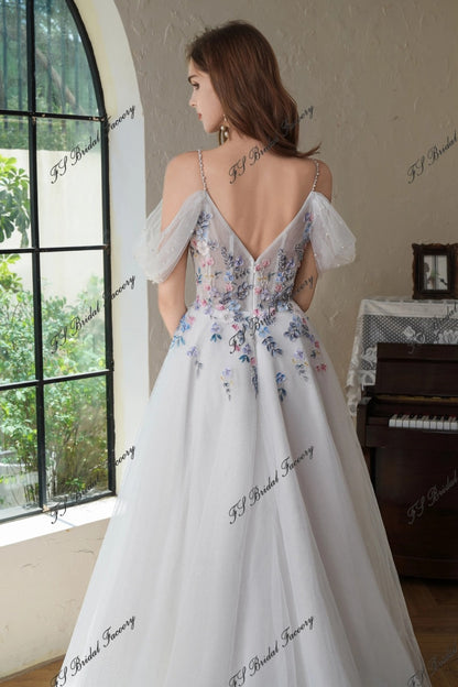 “Katrina” floral beaded lace wedding gown with sweep train and off-shoulder tulle sleeves.
