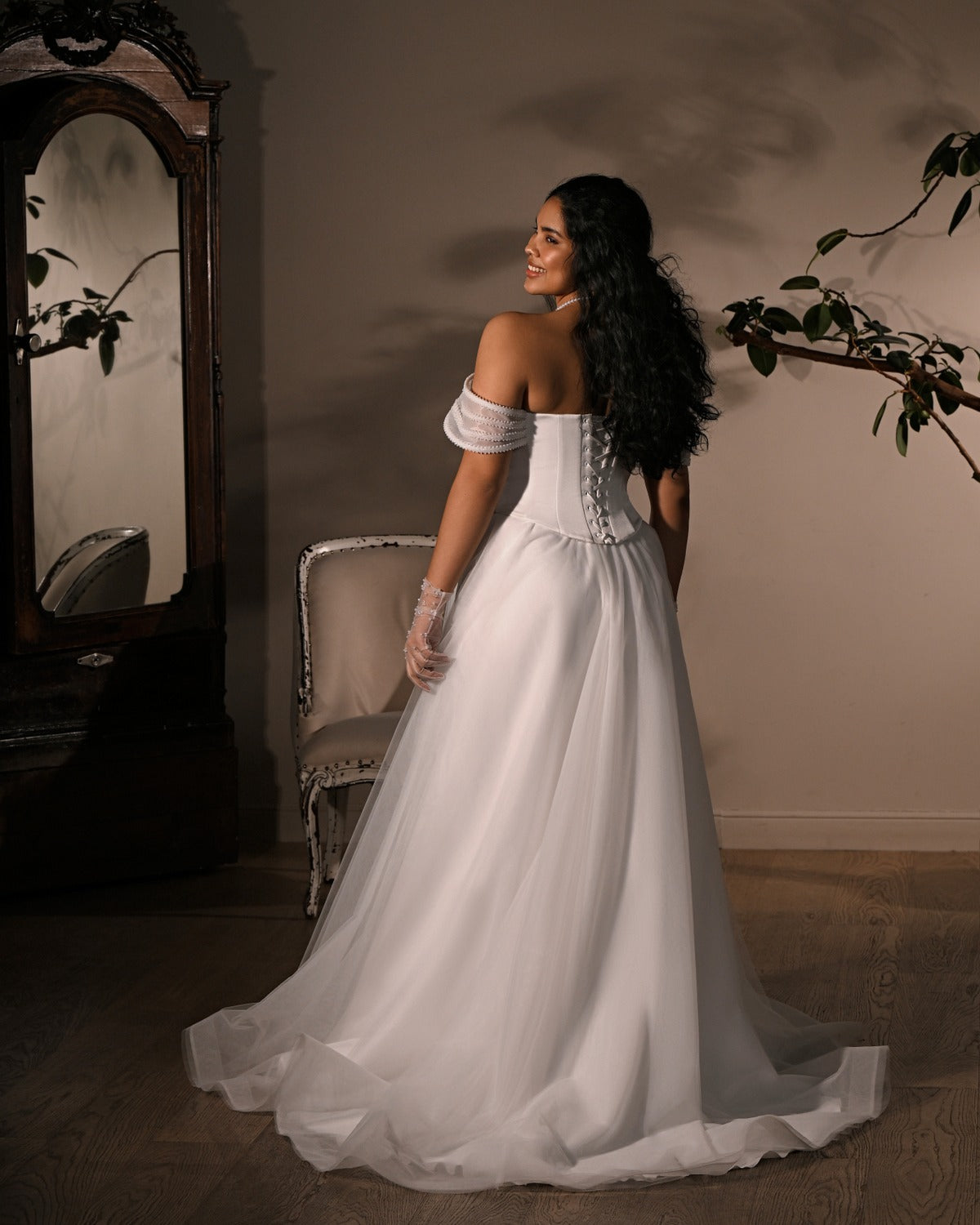 Back of Kookla Lilia wedding ball gown showing lace-up corset and sweeping euro-tulle train