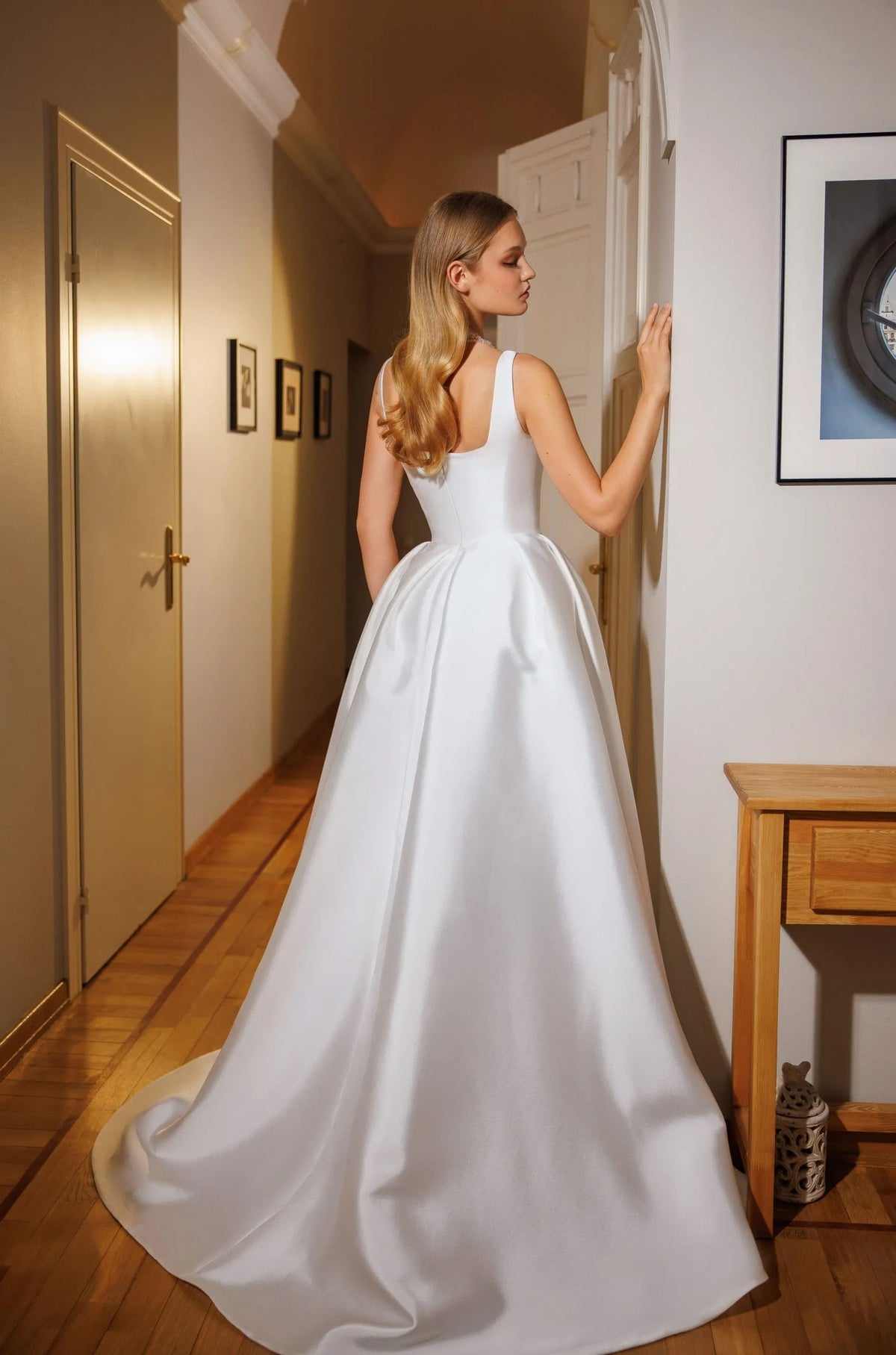 Back of Cappella Natalia Romanova satin bridal ball gown with square back neckline and sweeping train