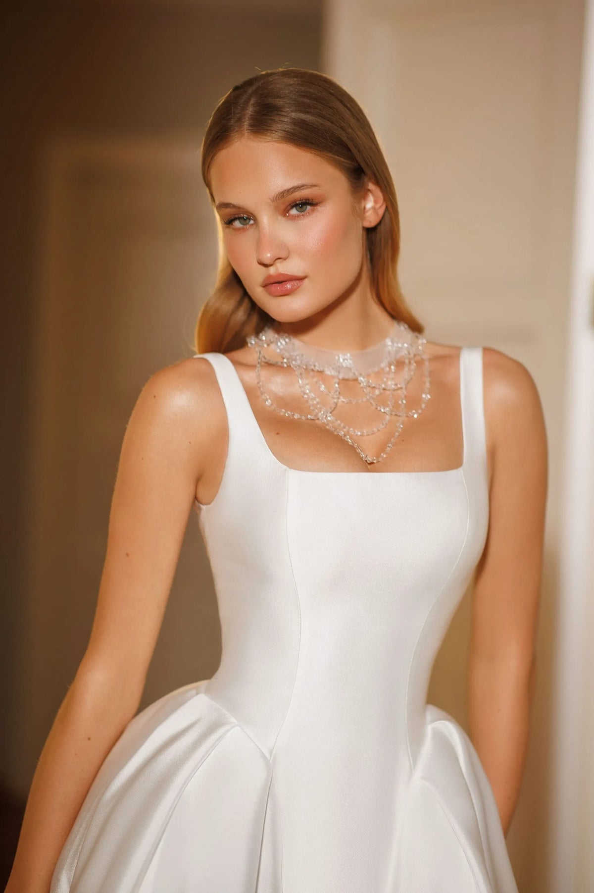 Cappella minimalist satin wedding gown with wide straps, square neckline and architectural skirt