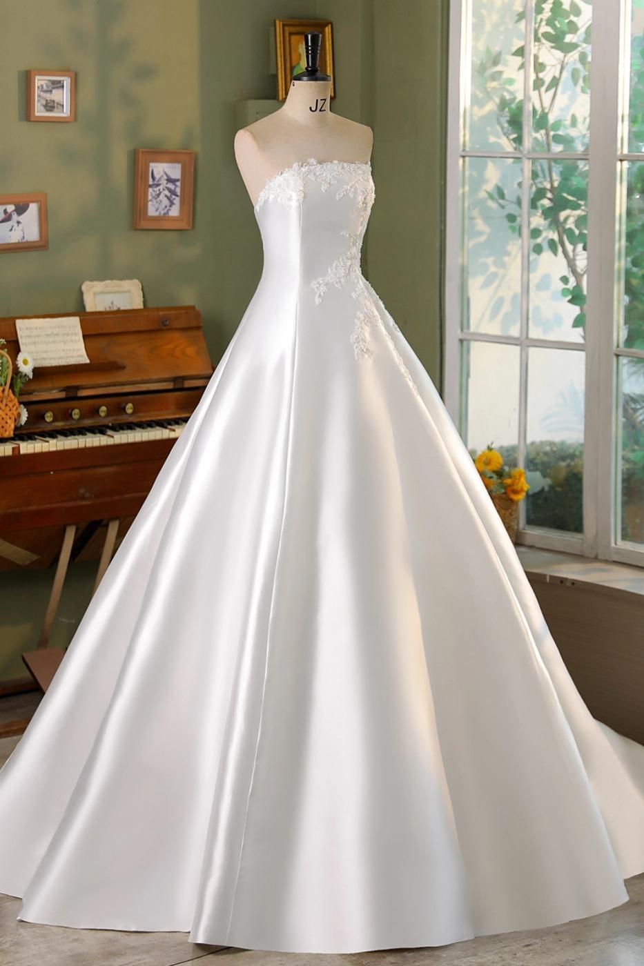 Phanessa strapless mikado ball gown wedding dress with lace and rhinestone bodice, full princess skirt, front view.