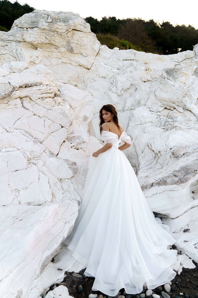 Elegant Off the Shoulder A-Line Wedding Dress Timeless Bridal Gown Straight Neckline Open Back Beautiful Flowing Train
