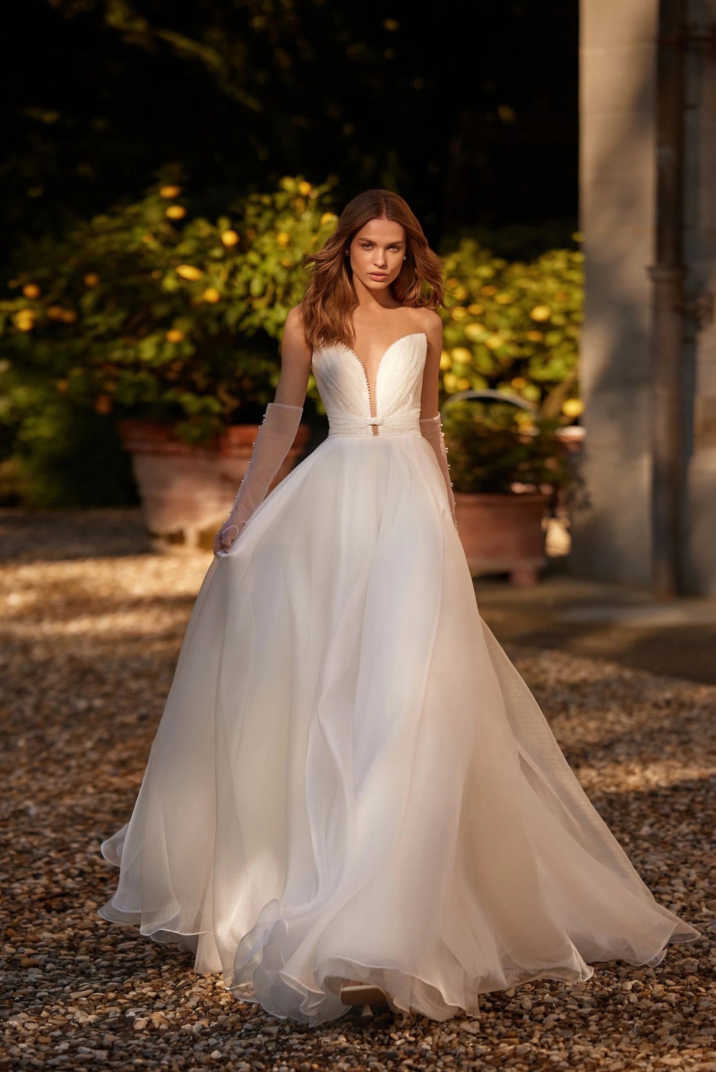 Exquisite Ivory Aline Wedding Dress Bridal Gown Organza with Deep Neckline Pearl Details Open Back Removable Back Bow